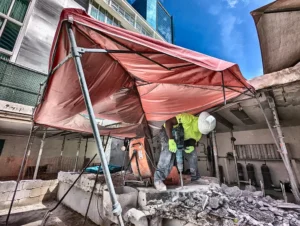 How to handle the removal and disposal of concrete debris after a demolition process