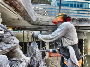 How to minimize dust and debris during a residential concrete demolition