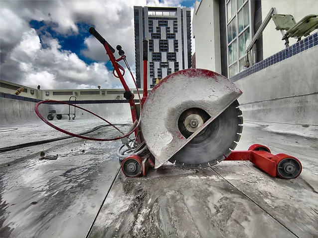 Using the slab saw to cut a pool in downtown miami