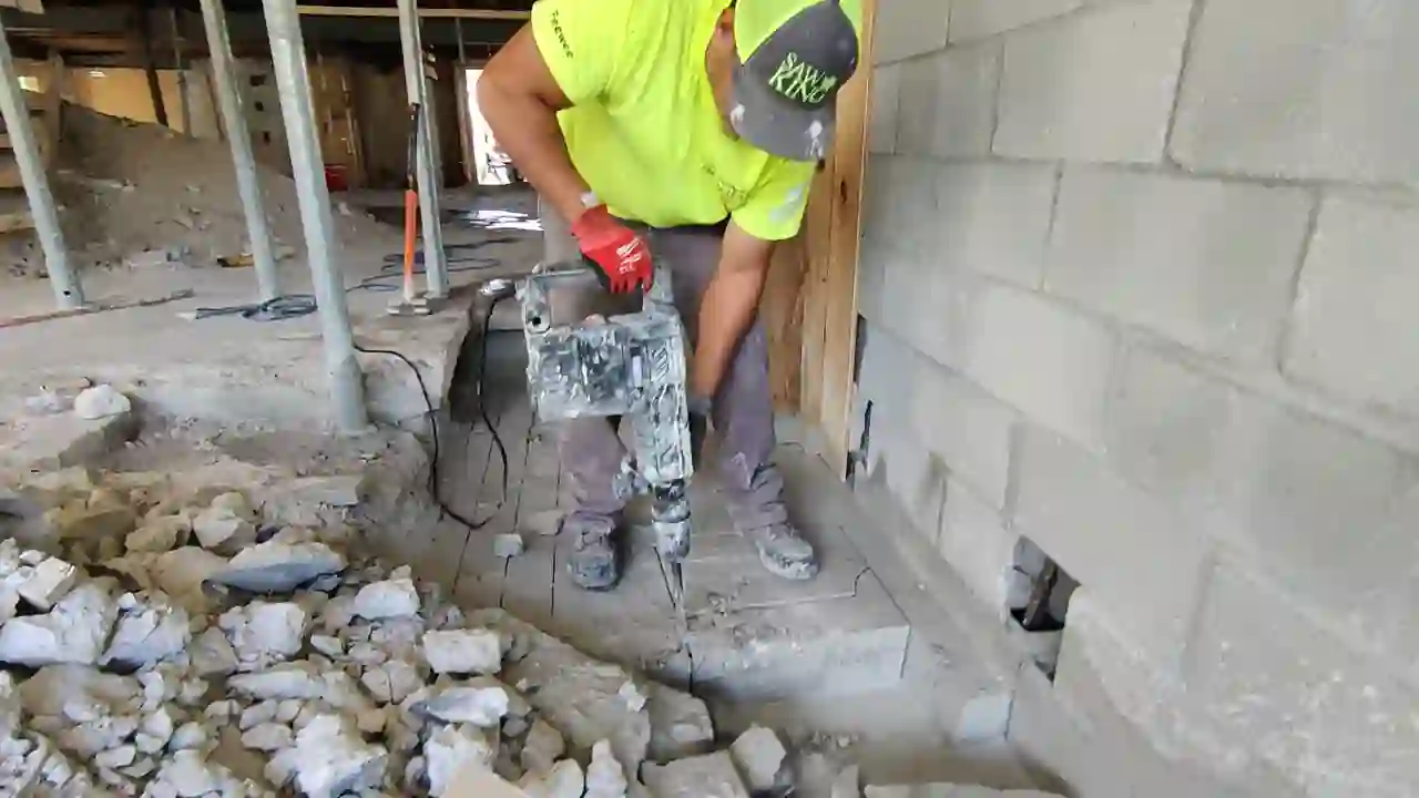 Breaking Thick Concrete Slabs By Hand While Maintaining OSHA Safety Standards