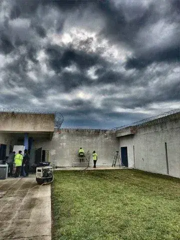 cutting walls inside jail
